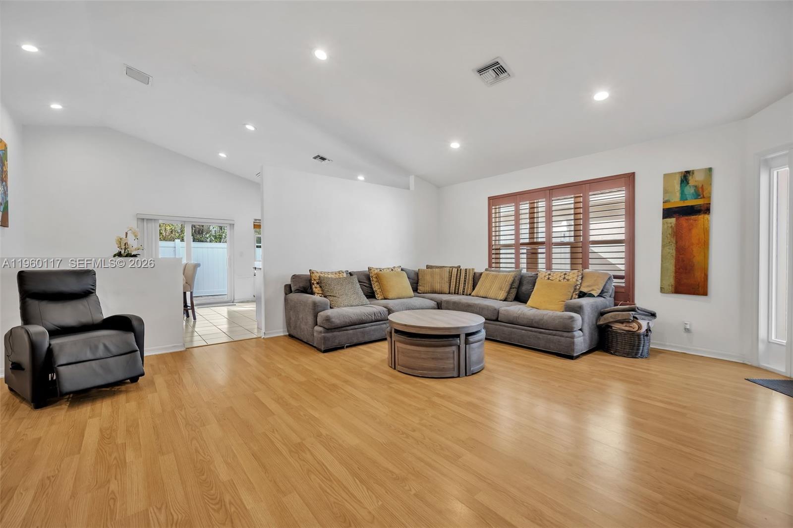 10337 Coventry Court Boca Raton, FL 33428 - Photo 12 of 44 a living room with furniture and a window