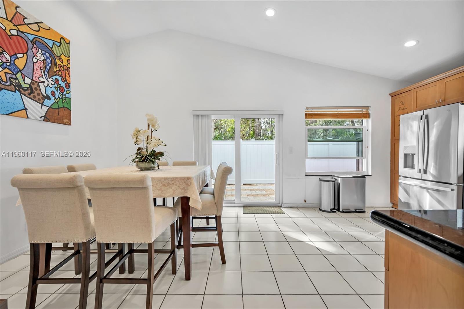 10337 Coventry Court Boca Raton, FL 33428 - Photo 17 of 44 a dining room with furniture and window