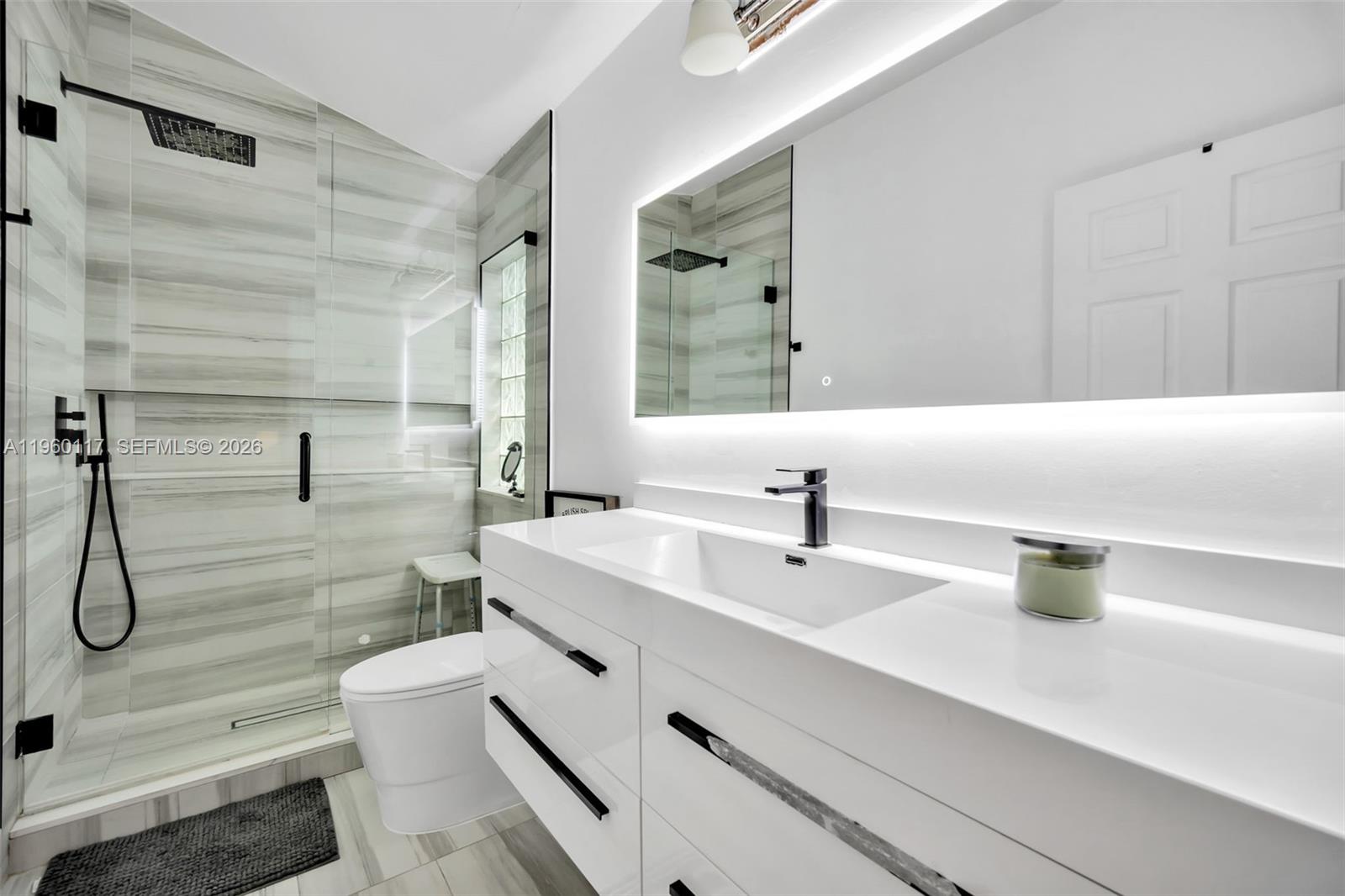 10337 Coventry Court Boca Raton, FL 33428 - Photo 24 of 44 a bathroom with a sink a toilet and shower