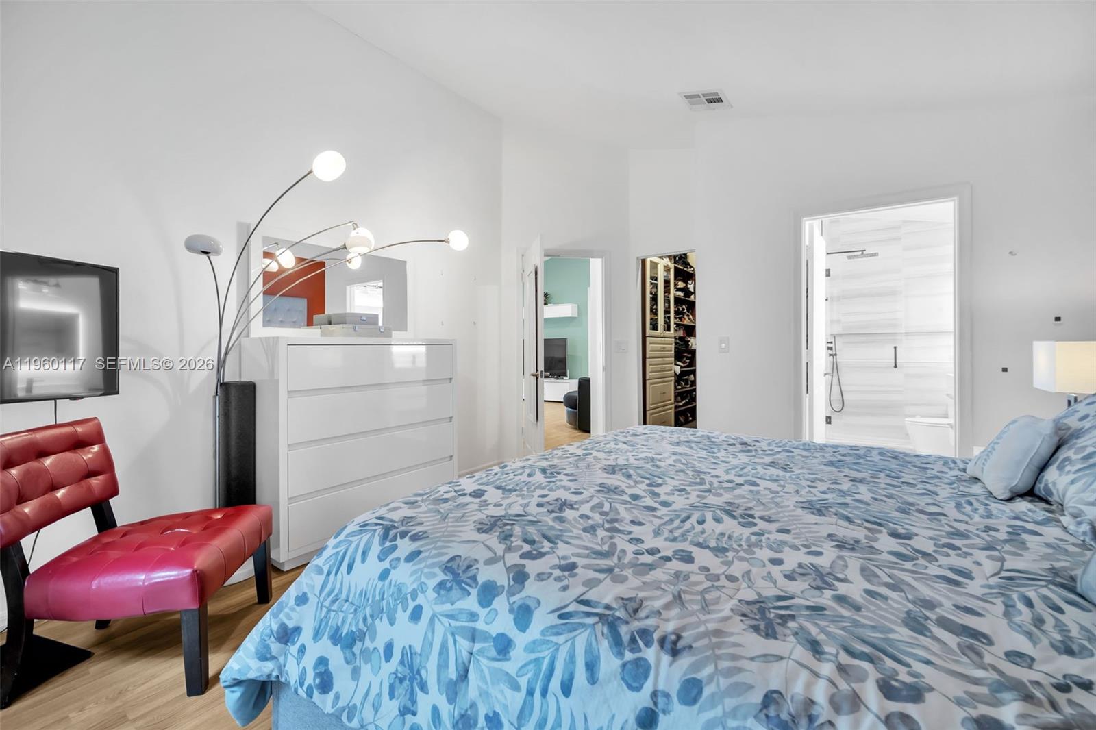 10337 Coventry Court Boca Raton, FL 33428 - Photo 25 of 44 a bedroom with a bed and dresser