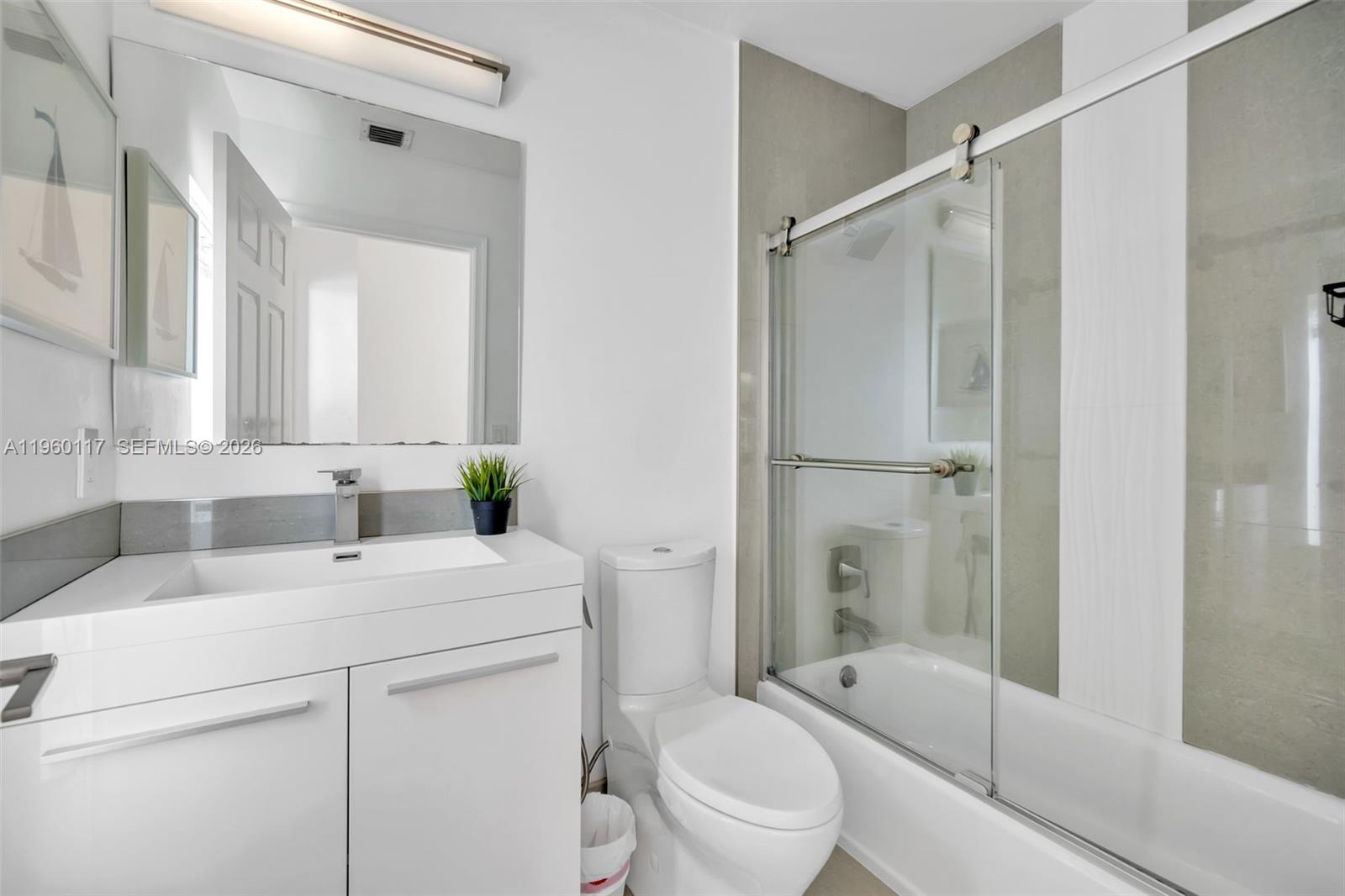 10337 Coventry Court Boca Raton, FL 33428 - Photo 28 of 44 a bathroom with a sink toilet and shower