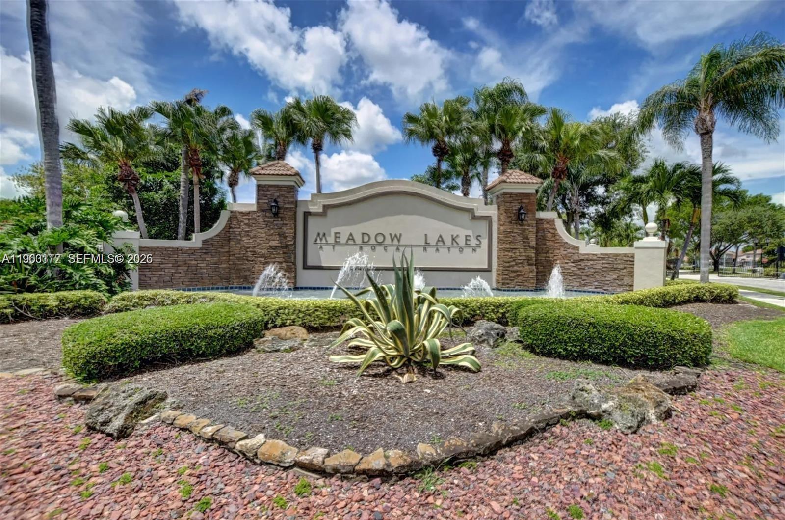 10337 Coventry Court Boca Raton, FL 33428 - Photo 3 of 44 a view of a house with a yard and potted plants