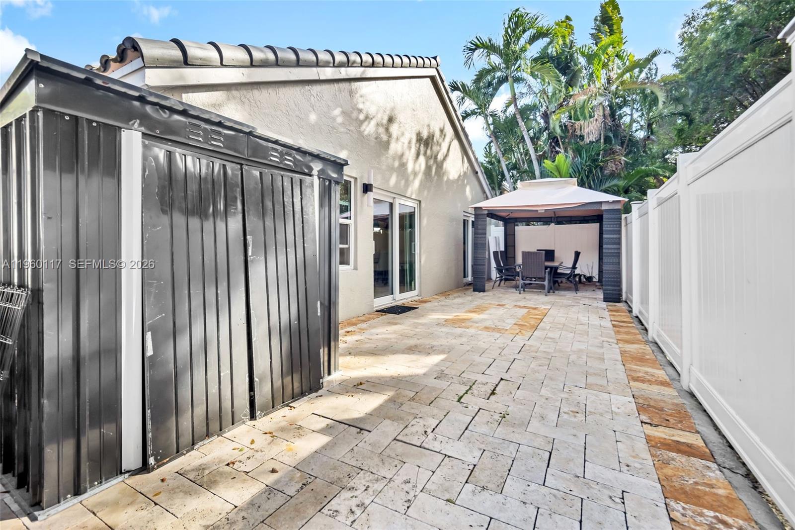 10337 Coventry Court Boca Raton, FL 33428 - Photo 36 of 44 a view of a house with backyard and sitting area