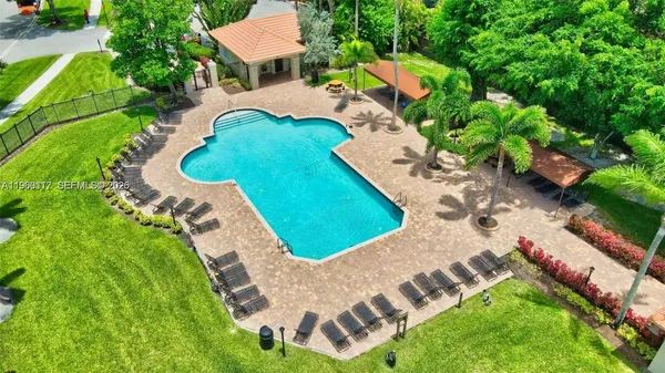 a view of swimming pool with a backyard