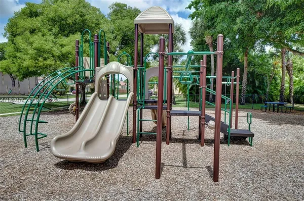 a view of a backyard with sitting area