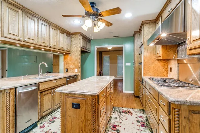 a kitchen that has a lot of cabinets in it