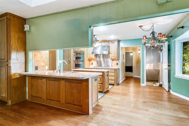 a view of livingroom with hardwood floor and a ceiling fan