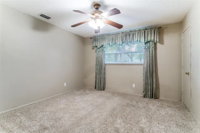 a bathroom with a toilet a sink a tub and mirror