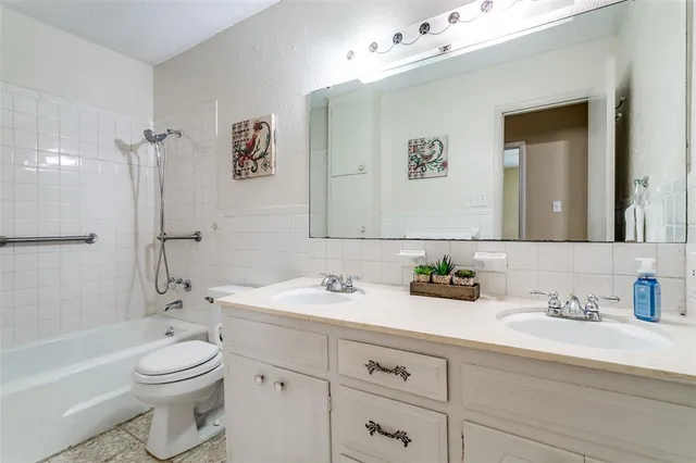 a bedroom with bed and wooden floor