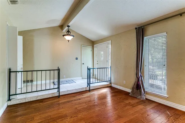 a view of entryway with wooden floor