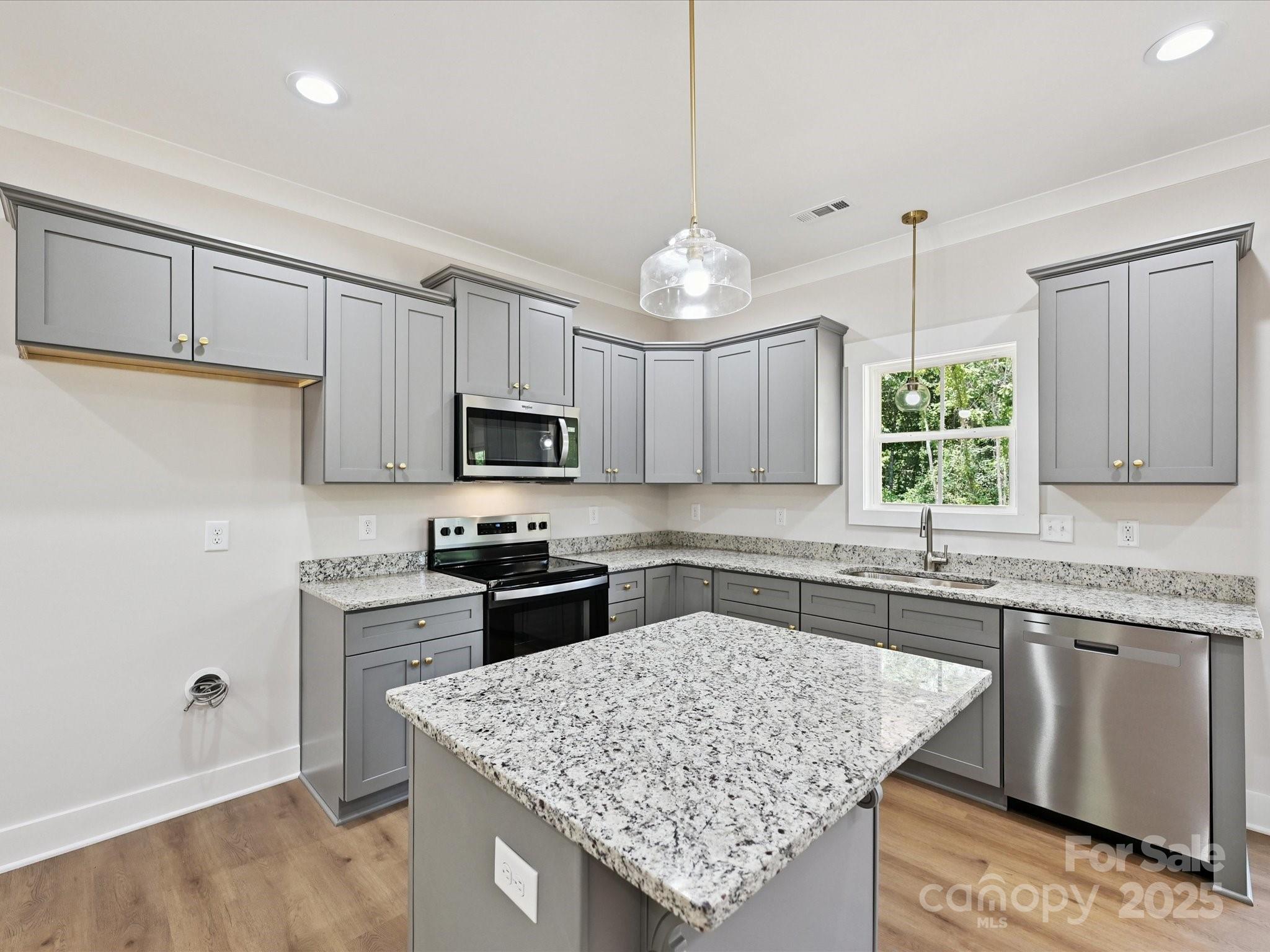 280 Old Pinckney Road York, SC 29745 - Photo 11 of 29 a kitchen with stainless steel appliances granite countertop a sink stove and refrigerator