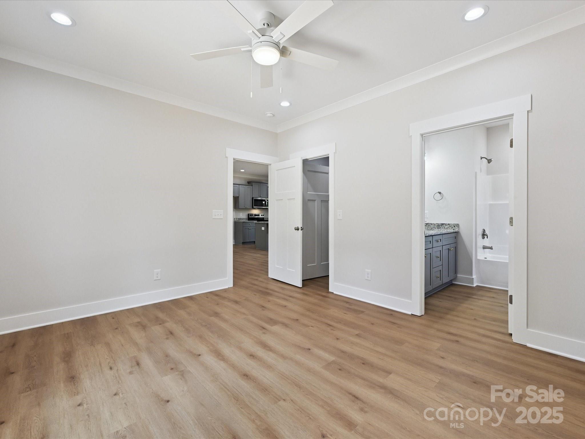 280 Old Pinckney Road York, SC 29745 - Photo 18 of 29 an empty room with wooden floor and a ceiling fan