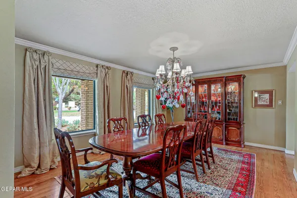 a view of a chairs and table in a patio