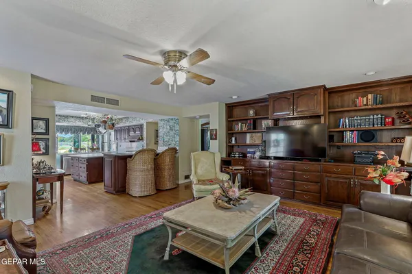 a spacious bathroom with a double vanity sink a large mirror and bathtub