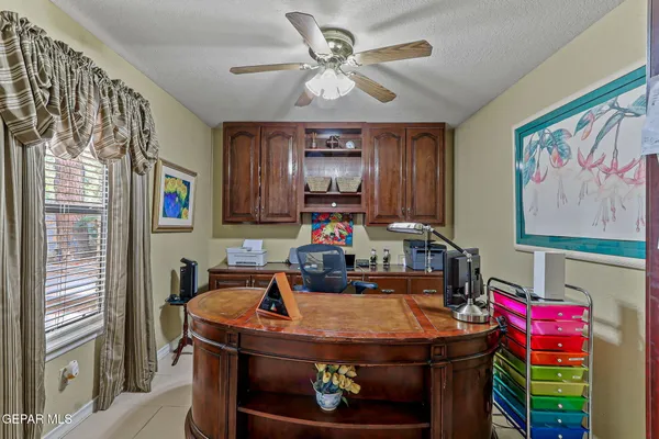 a front view of house with yard barbeque and outdoor seating