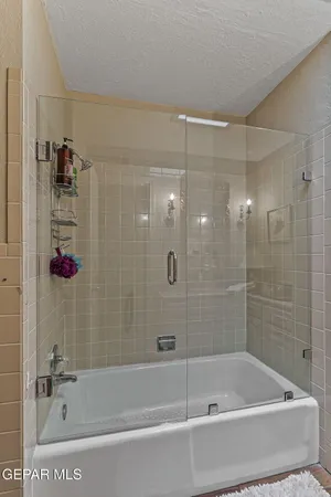 an aerial view of green landscape with trees houses and mountain view