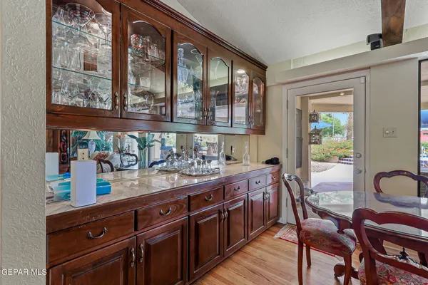 a kitchen with stainless steel appliances granite countertop a sink and a stove