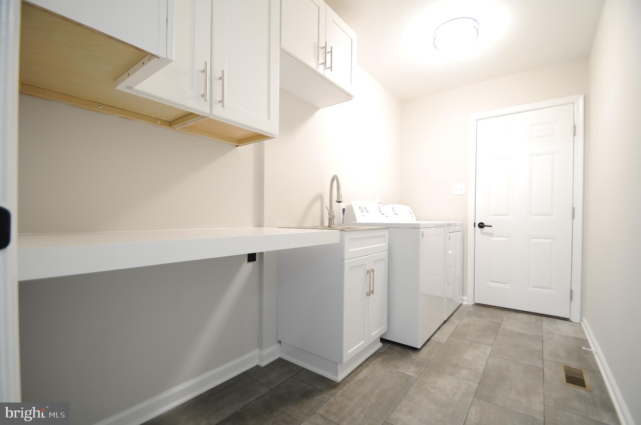 12023 Canter Lane Reston, VA 20191 - Photo 25 of 48 Laundry Area w/ Deep Sink & Access to Garage