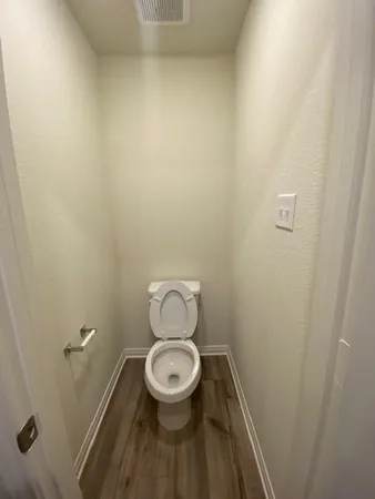 a bathroom with a toilet and a sink