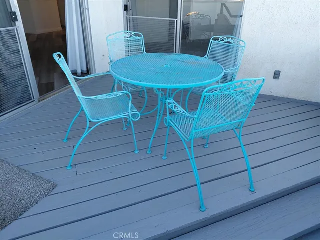 a view of a room with wooden furniture