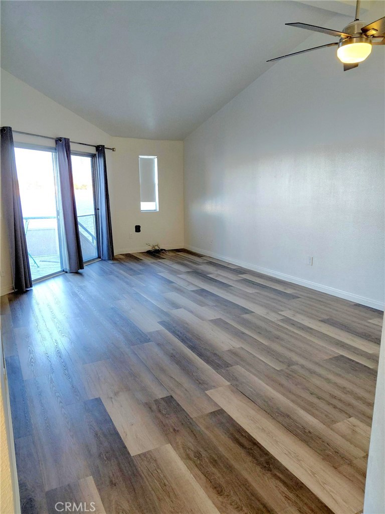 14530 Nautical Lane, Unit 15 Helendale, CA 92342 - Photo 4 of 14 a view of empty room with wooden floor