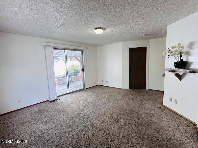 1182 Blue Lakes Road Reno, NV 89523 - Photo 10 of 31 a view of an empty room with a window