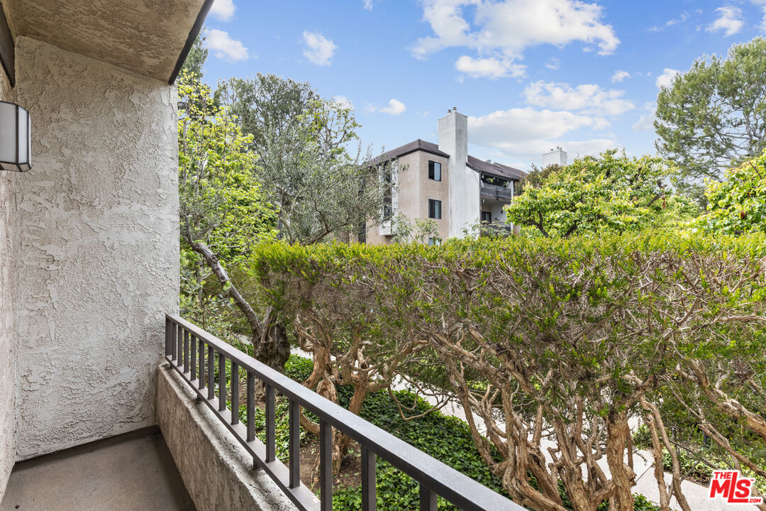 8110 Manitoba Street, Unit 106 Playa del Rey, CA 90293 - Photo 12 of 20 a view of a house with a flower garden