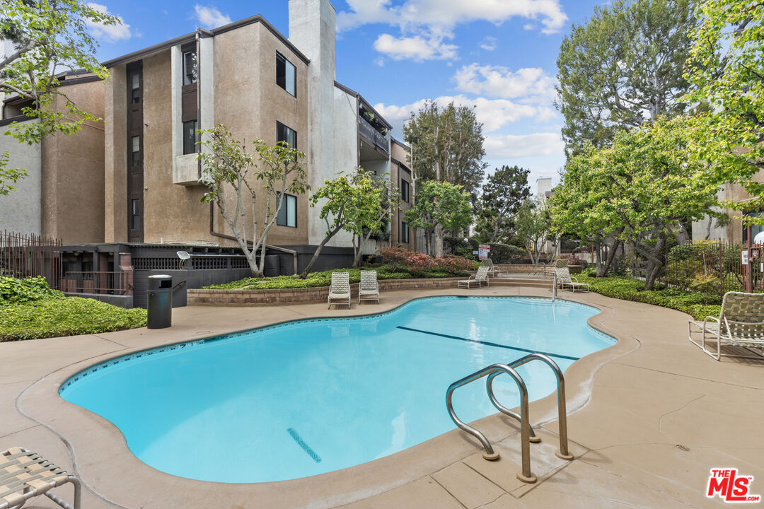 8110 Manitoba Street, Unit 106 Playa del Rey, CA 90293 - Photo 14 of 20 a view of a swimming pool with chairs
