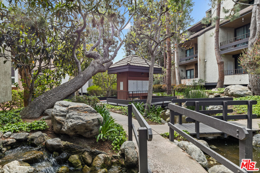 8110 Manitoba Street, Unit 106 Playa del Rey, CA 90293 - Photo 16 of 20 a front view of house with yard and outdoor seating