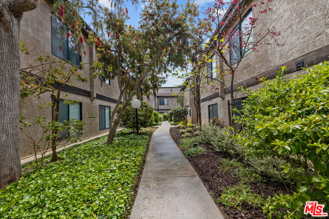 8110 Manitoba Street, Unit 106 Playa del Rey, CA 90293 - Photo 19 of 20 a view of a pathway with house on both side