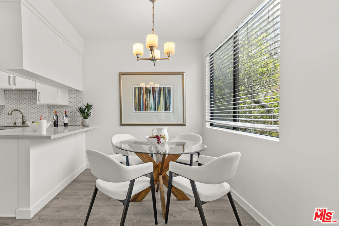 8110 Manitoba Street, Unit 106 Playa del Rey, CA 90293 - Photo 5 of 20 a dining room with furniture and window