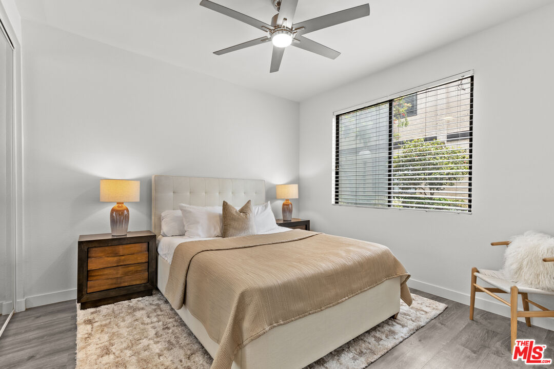 8110 Manitoba Street, Unit 106 Playa del Rey, CA 90293 - Photo 9 of 20 a bedroom with a bed and a window