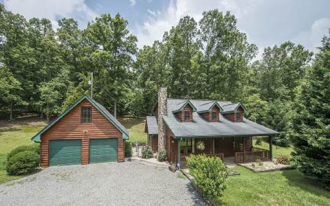 341 Curtis Switch Road Blue Ridge, GA 30513 - Photo 1 of 1 a view of a house with a yard and large tree