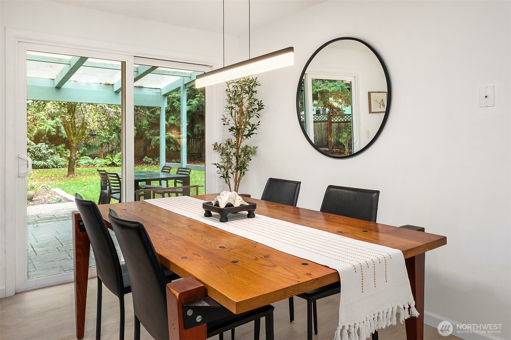 18304 McLean Road Southwest Vashon, WA 98070 - Photo 14 of 36 a dining room with furniture a mirror and a window