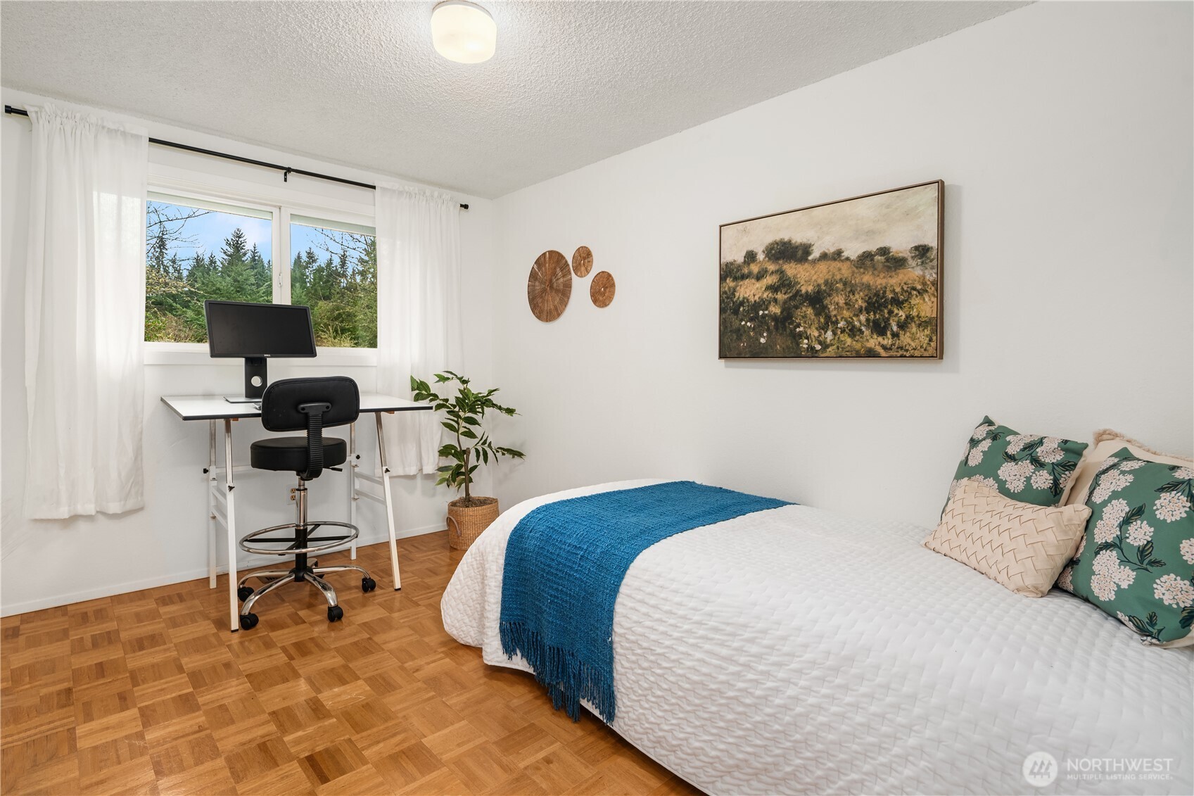 18304 McLean Road Southwest Vashon, WA 98070 - Photo 19 of 36 a bedroom with a bed and a window