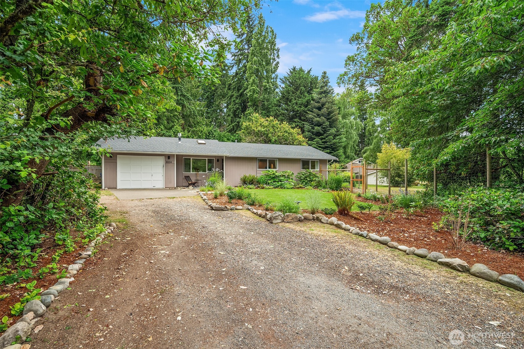 18304 McLean Road Southwest Vashon, WA 98070 - Photo 34 of 36 front view of a house with a street