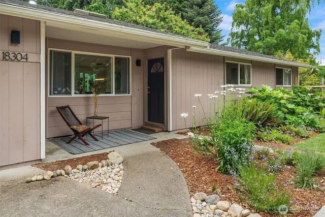 a view of backyard with a chair and tables