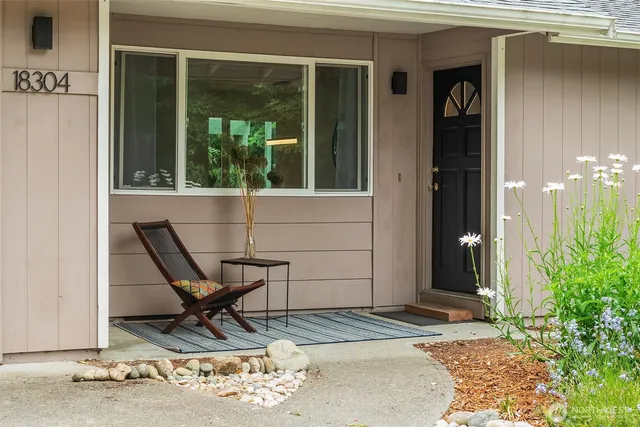 a view of a wooden bench sitting in front of a building