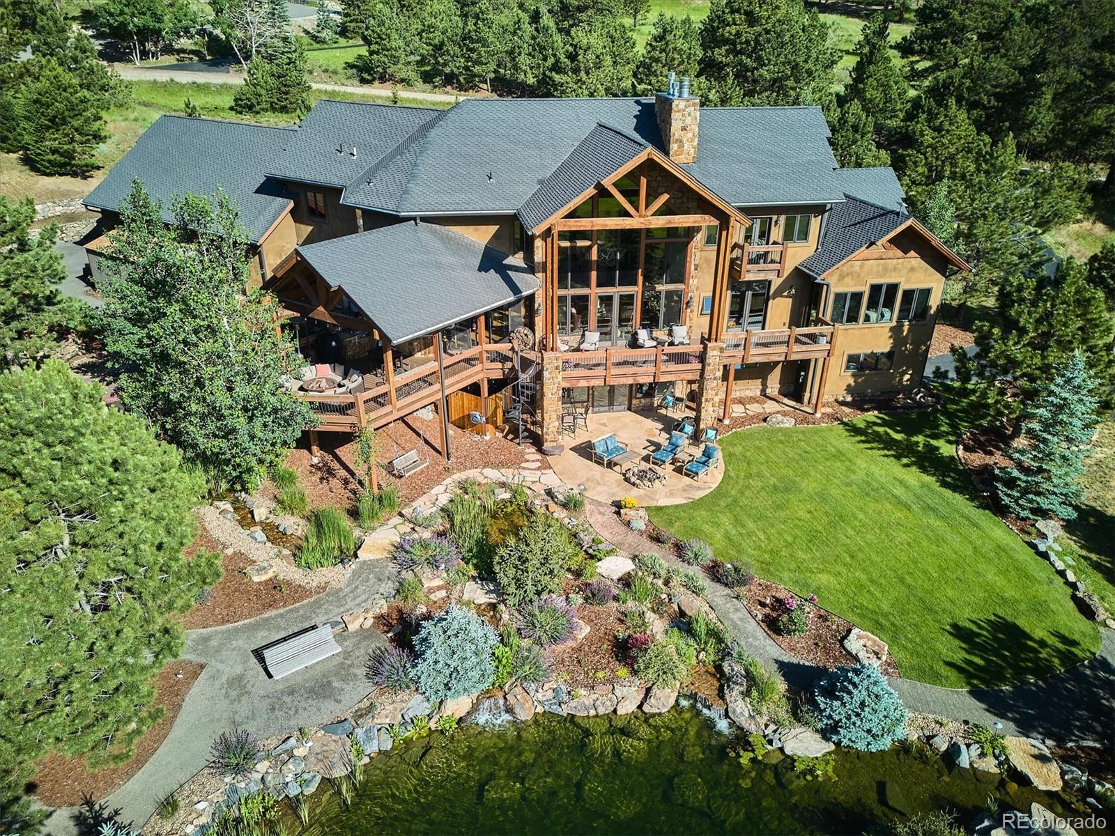 477 West Meadow Road Evergreen, CO 80439 - Photo 1 of 50 an aerial view of a house