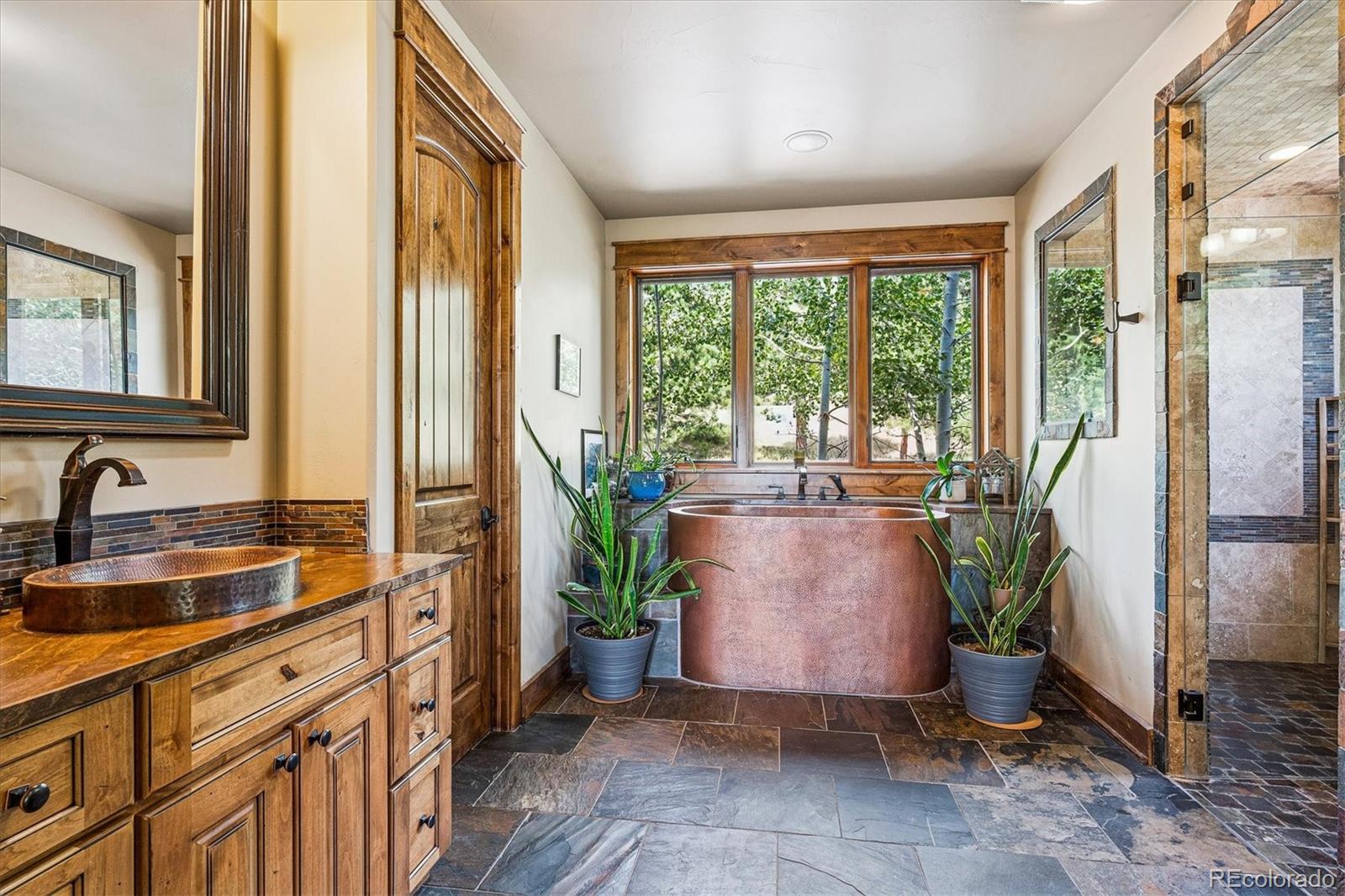 477 West Meadow Road Evergreen, CO 80439 - Photo 21 of 50 a view of a sink and garden