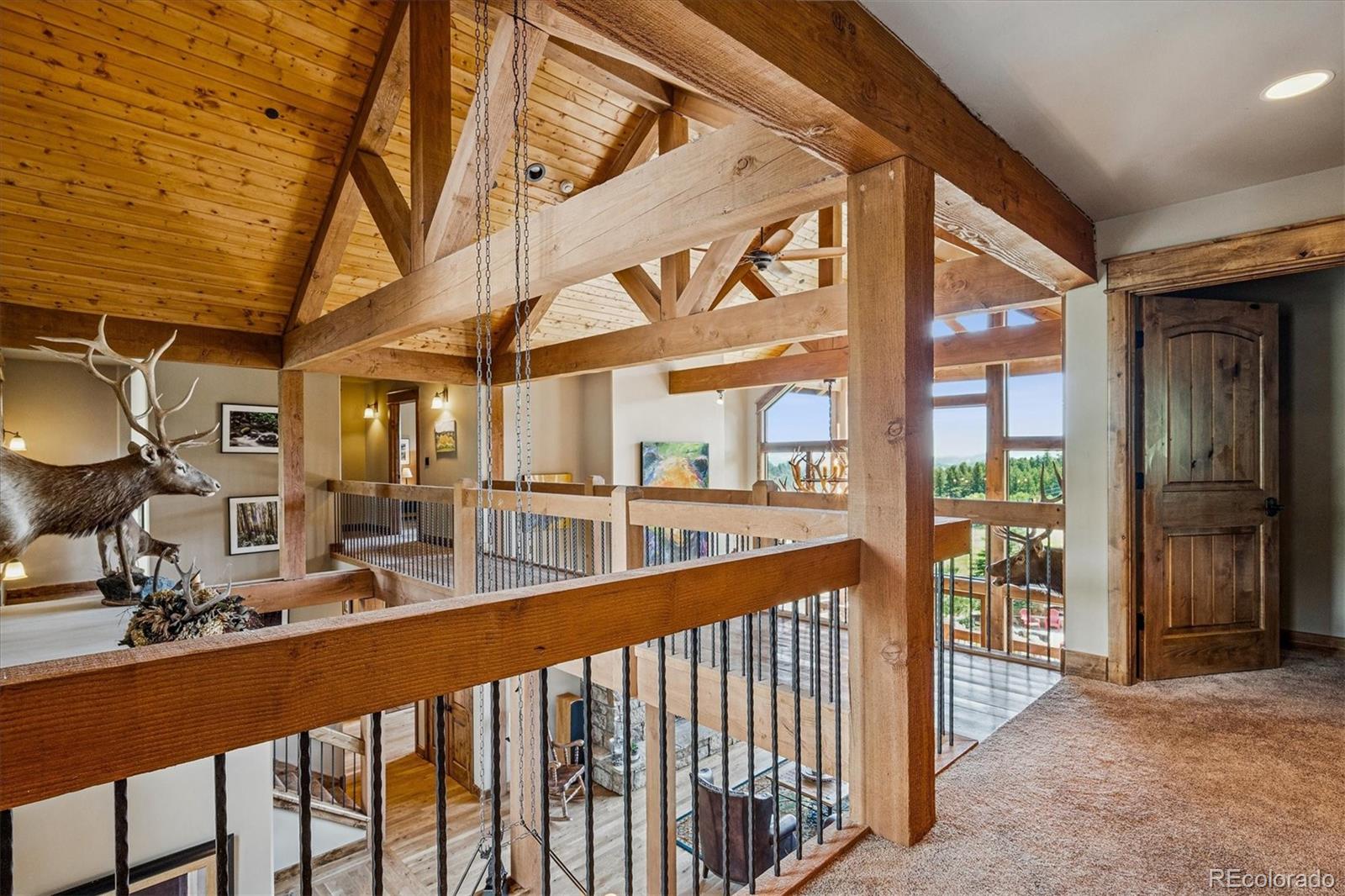477 West Meadow Road Evergreen, CO 80439 - Photo 27 of 50 a view of a porch with chairs