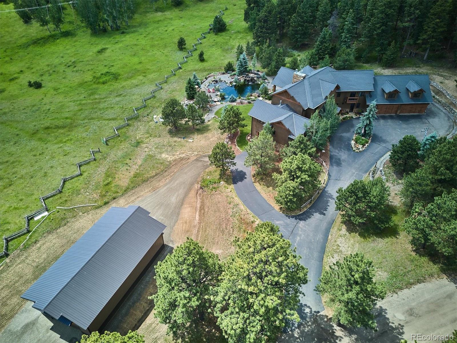 477 West Meadow Road Evergreen, CO 80439 - Photo 45 of 50 an aerial view of house with yard