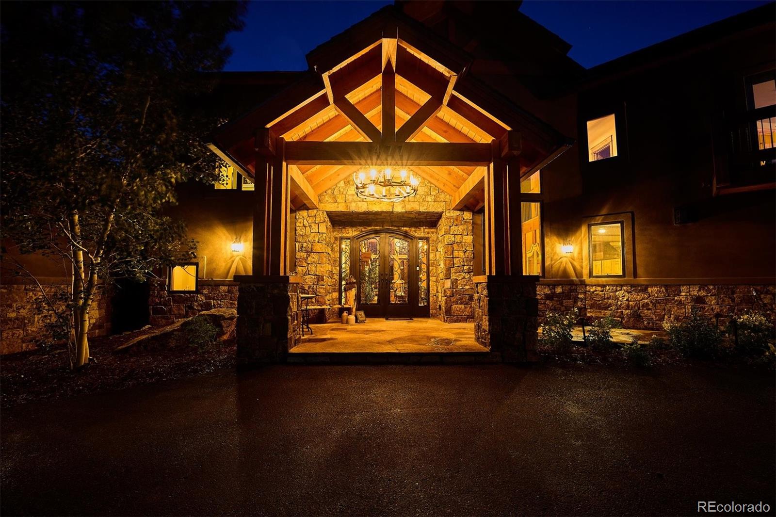 477 West Meadow Road Evergreen, CO 80439 - Photo 6 of 50 a view of a porch with a fireplace