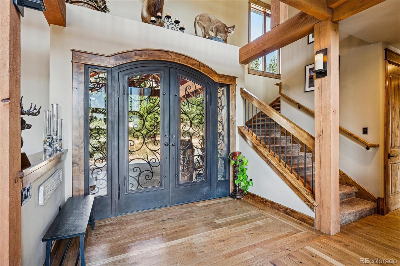 477 West Meadow Road Evergreen, CO 80439 - Photo 8 of 50 a view of an entryway with wooden floor floors and a way to a dining table
