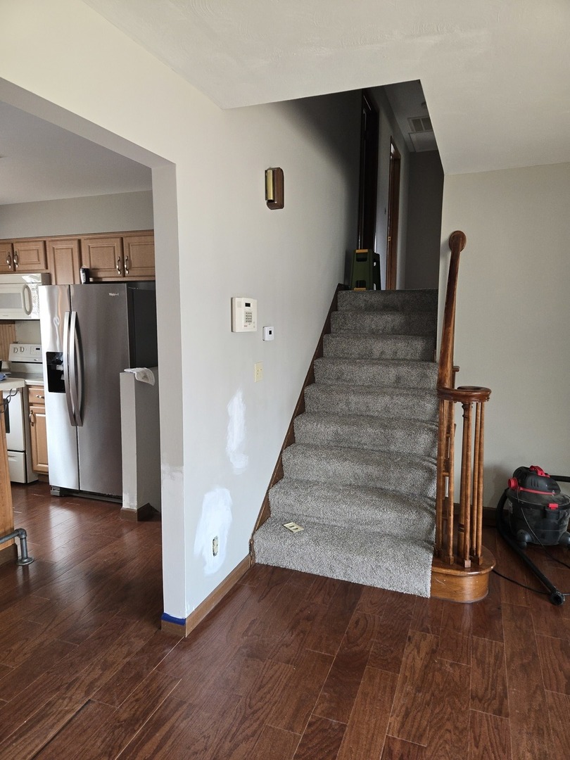 1309 Crest Lane Rochelle, IL 61068 - Photo 12 of 18 a view of entryway and hall with wooden floor