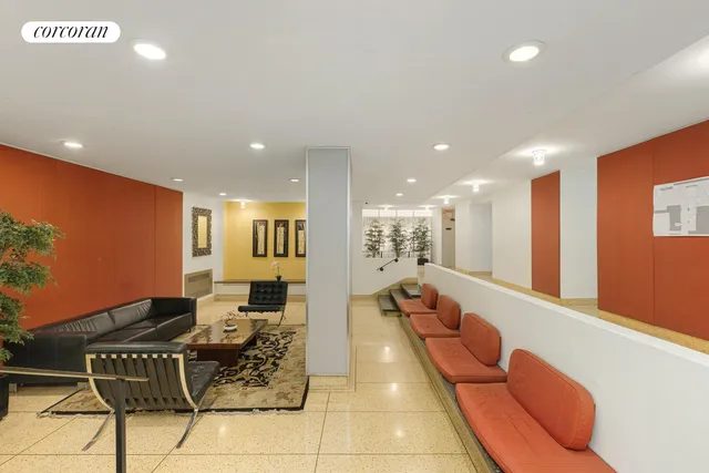 a view of a hallway with wooden floor and door