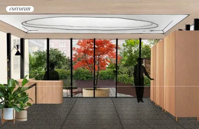 a lobby with a couch and a potted plant