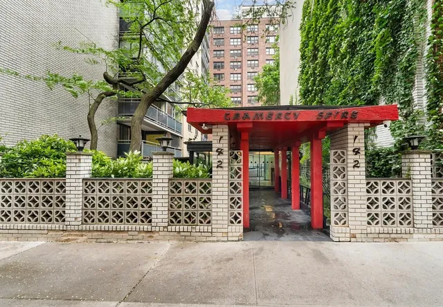 a bedroom with a large bed and a large window
