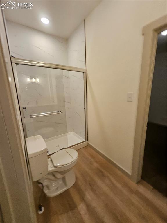 1138 Pine Street Pueblo, CO 81004 - Photo 15 of 22 a bathroom with a granite countertop toilet and a shower