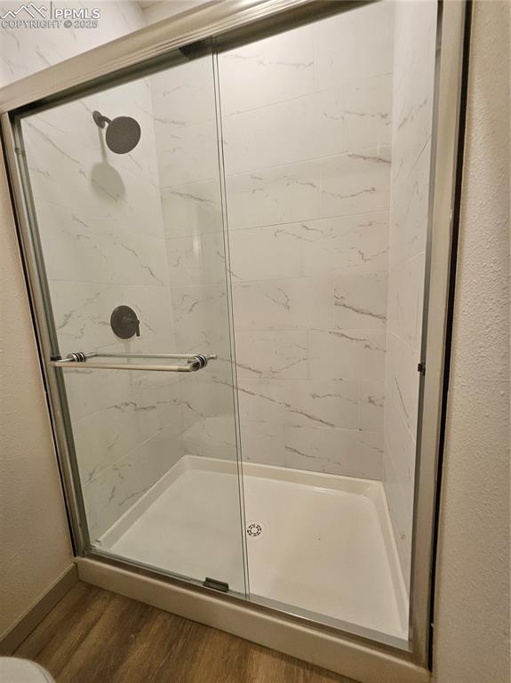 1138 Pine Street Pueblo, CO 81004 - Photo 17 of 22 a bathroom with a glass shower door